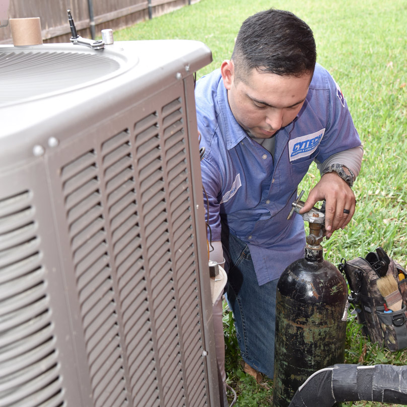 Cytech-AC-Repair-808×808 Cytech tech repairing an AC unit